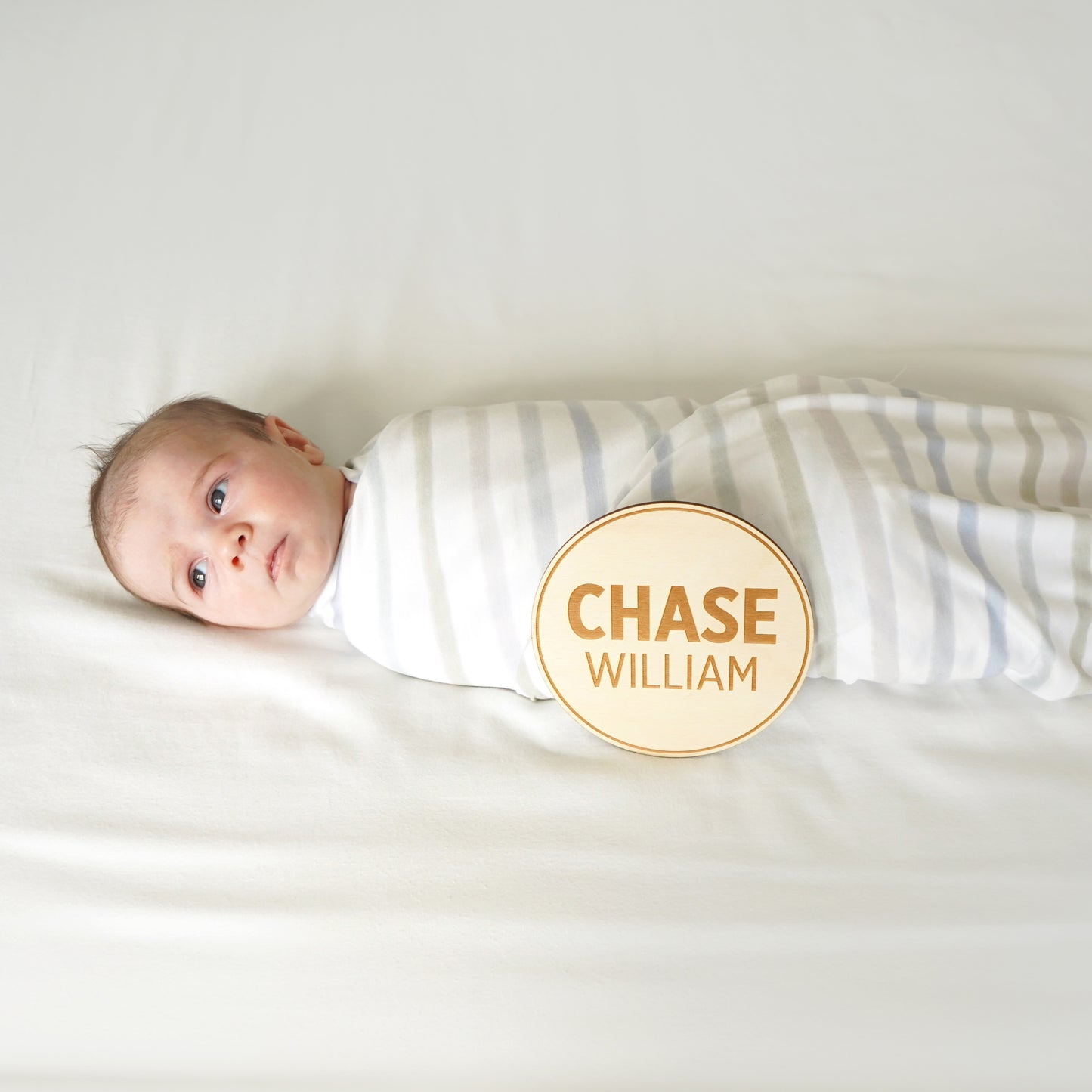 baby with name sign introduction