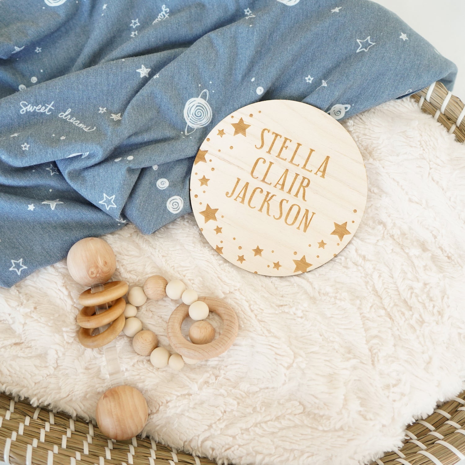 baby name sign with rattles blanket and bassinet