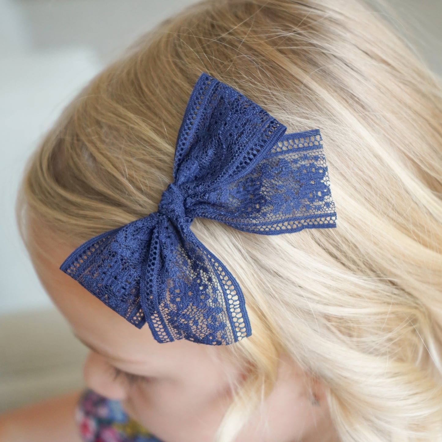 Audrey navy bow in big girl's hair