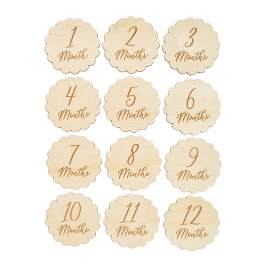 set of twelve village baby milestone signs for baby with script font and scalloped edge