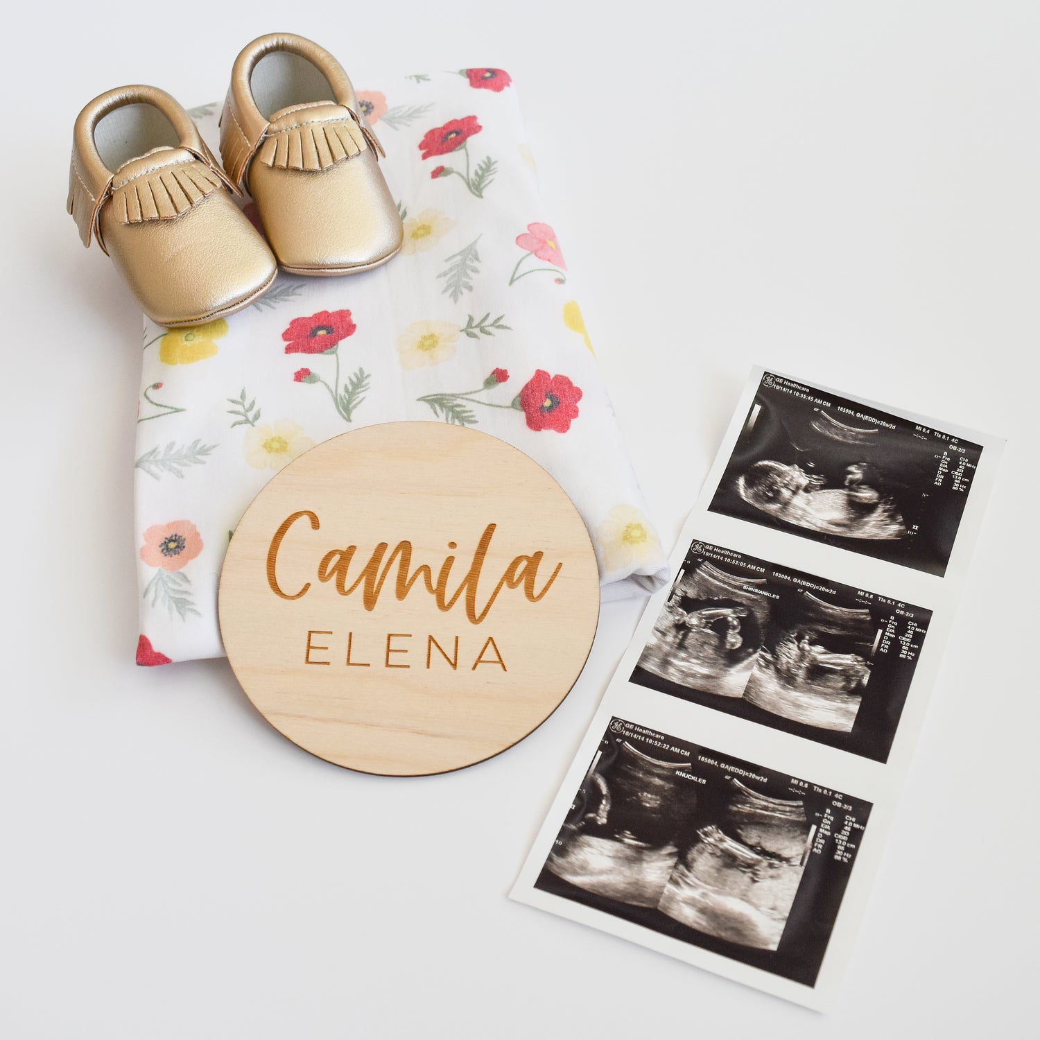 birth announcement with custom name sign, ultrasound, baby moccasin shoes and swaddle