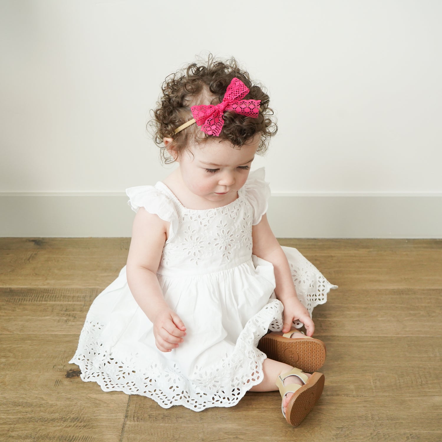 toddler wearing hot pink lace bow headband gift