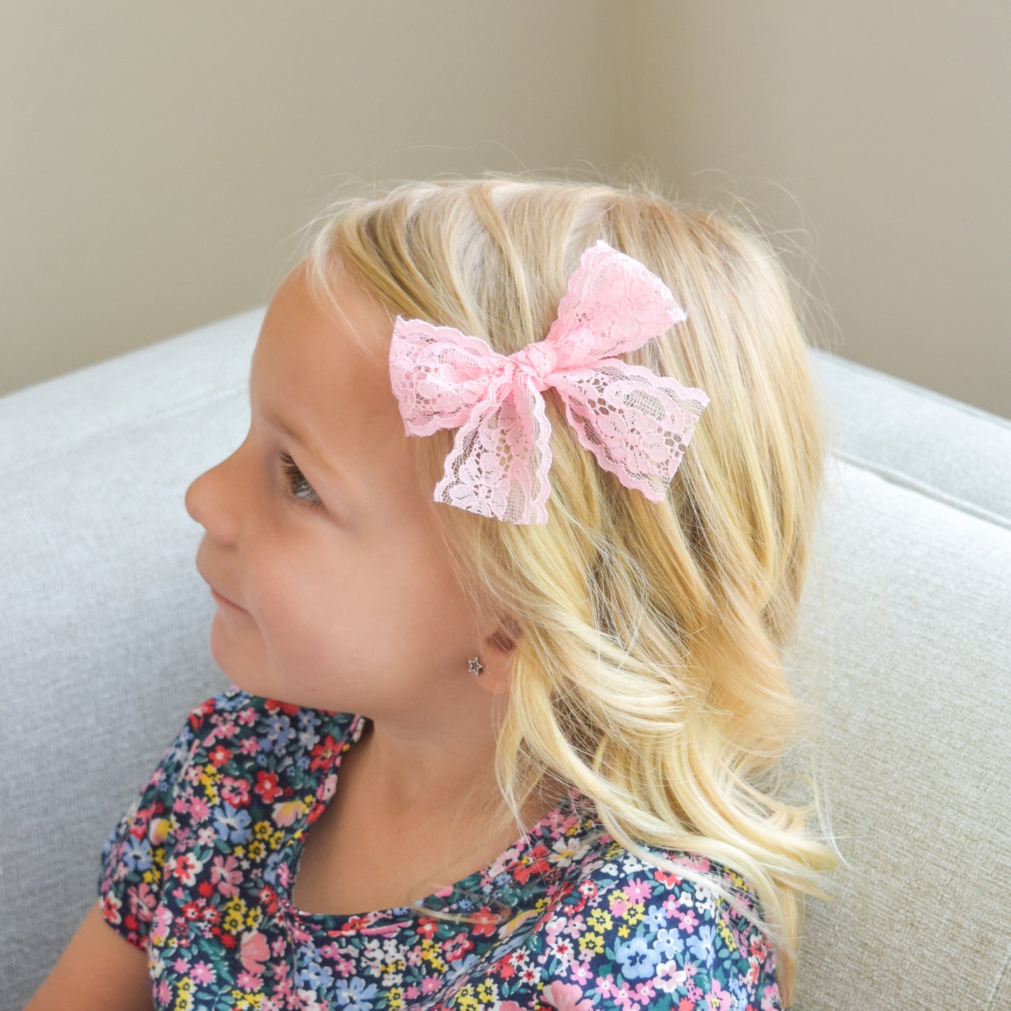 little girl with accessories Lucy pink lace clip in bow village baby