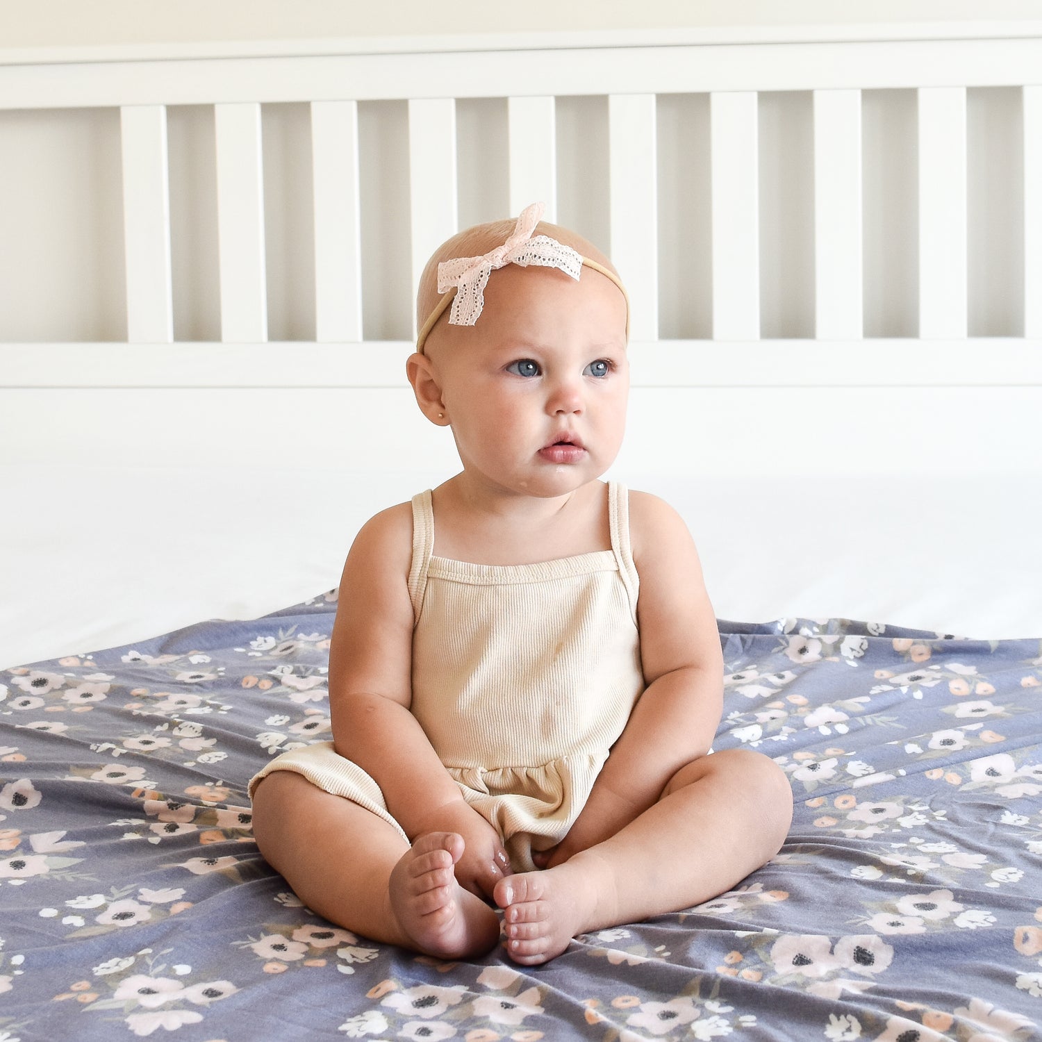 pale peach lace bow headband on baby girl with swaddle blanket accessory