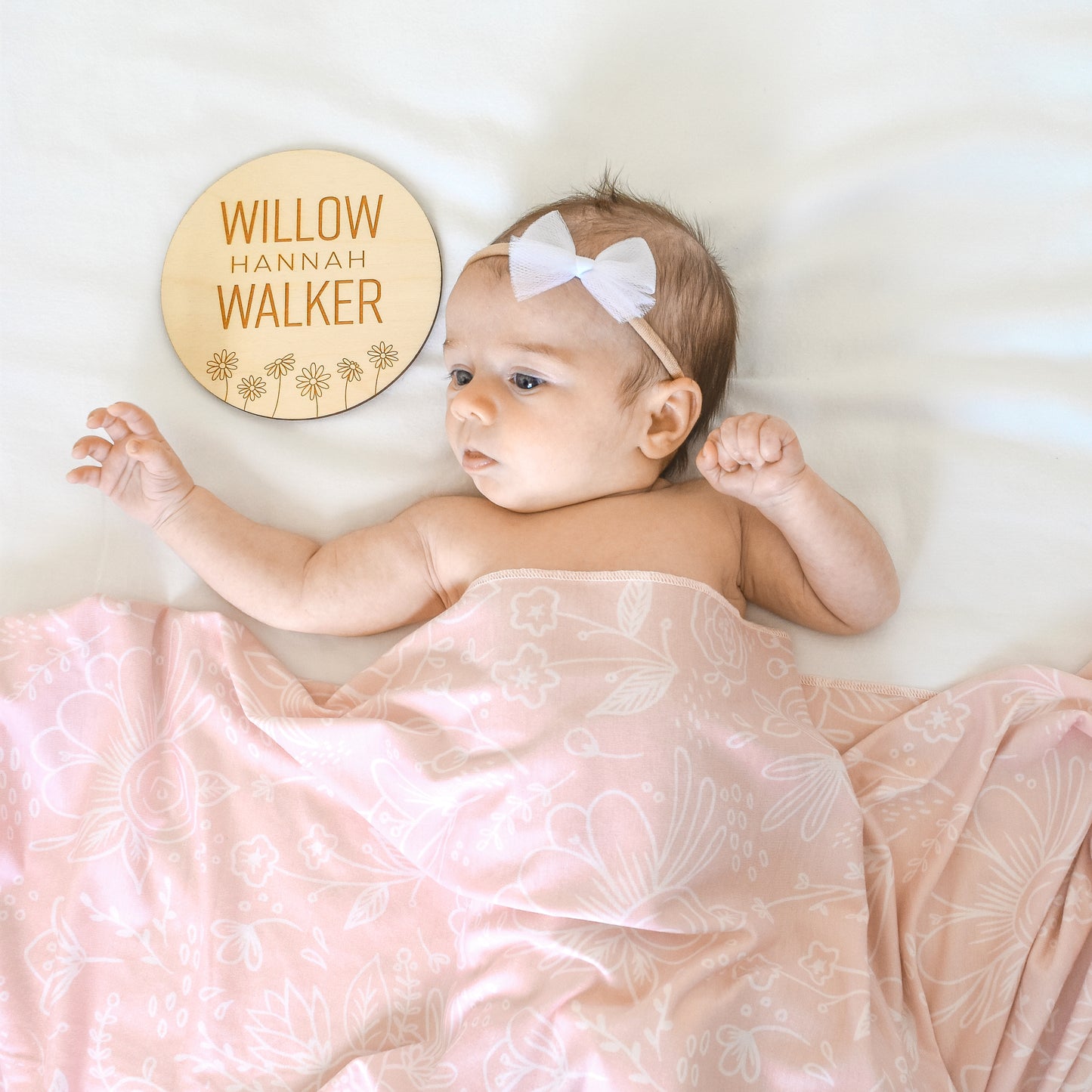 baby girl with round custom name sign baby gift set bow and blanket