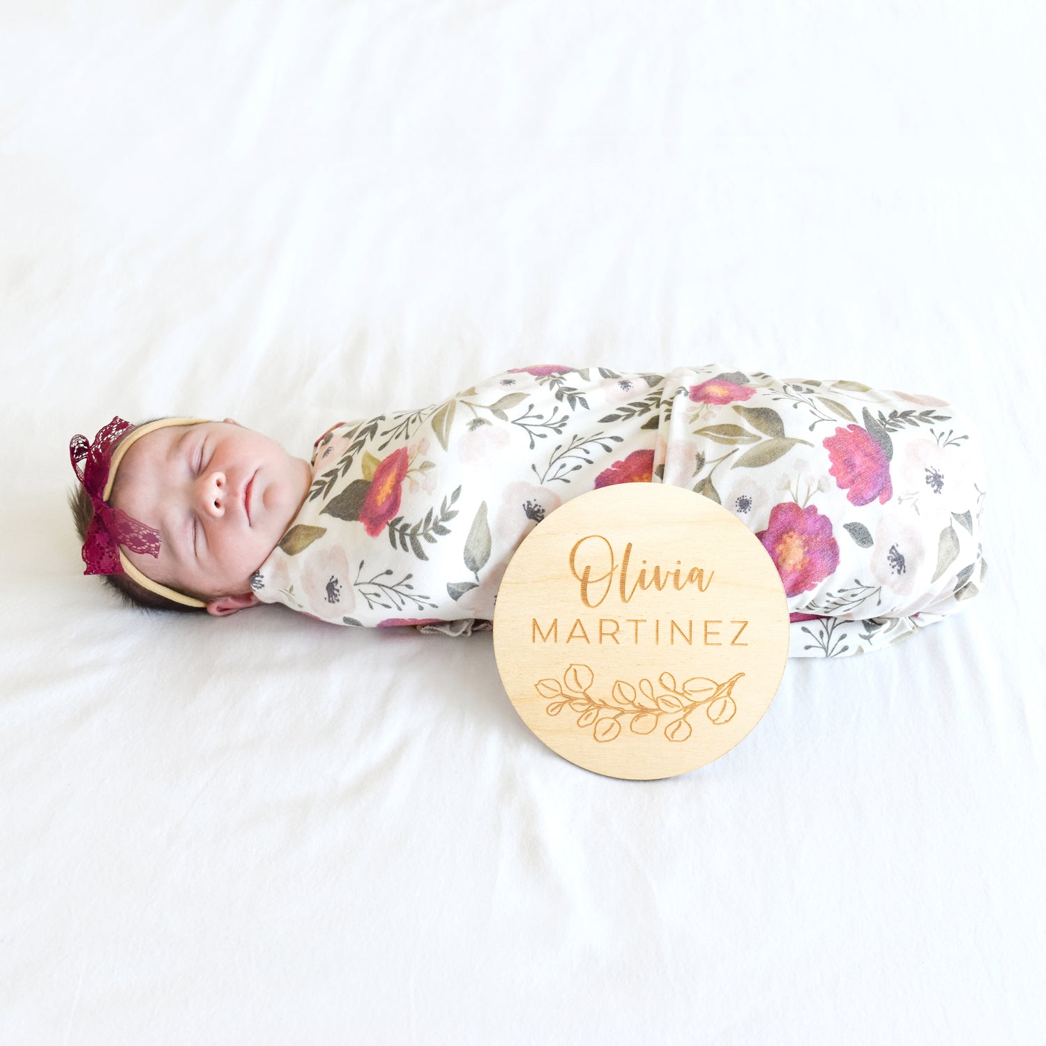 baby girl with bow, swaddle, and custom name sign best baby gift 